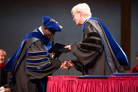 Dr. Joseph Dyaji receiving his Ph.D. from Dr. Lillback